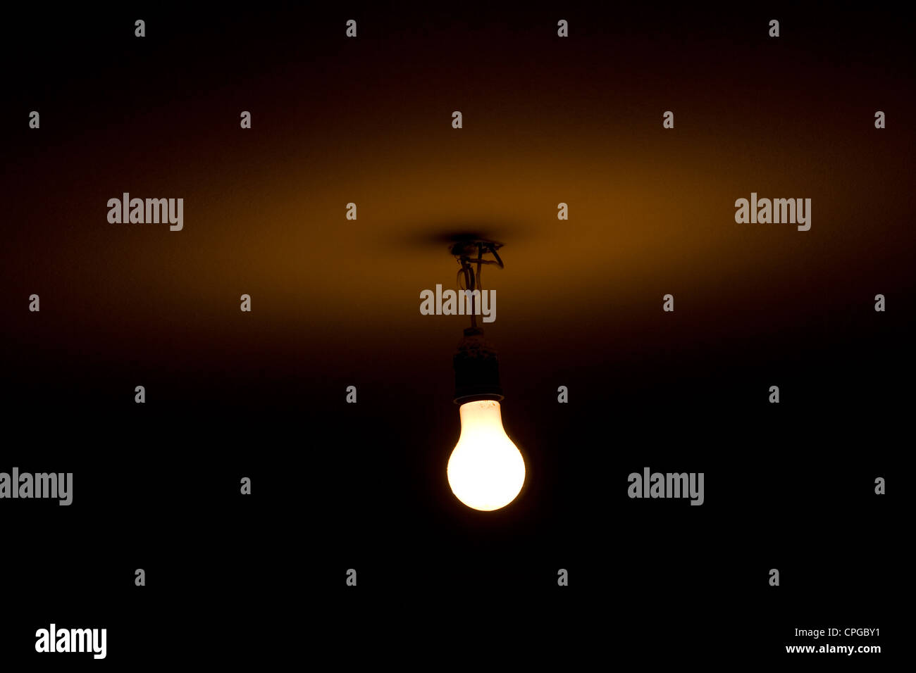 Bare light bulb hanging from the ceiling Stock Photo Alamy