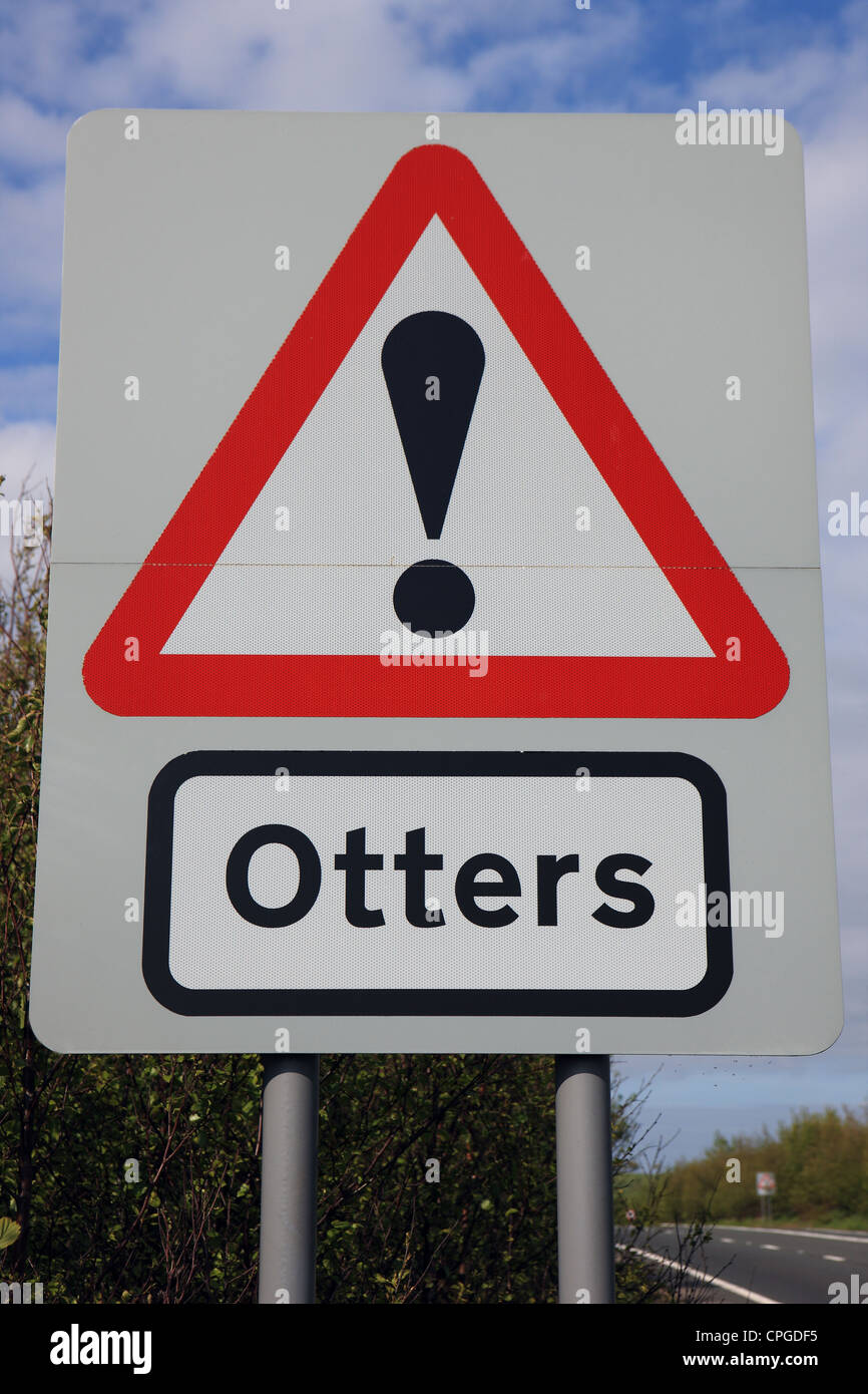 Warning sign for drivers that there are otters living nearby and may be crossing the road Stock Photo