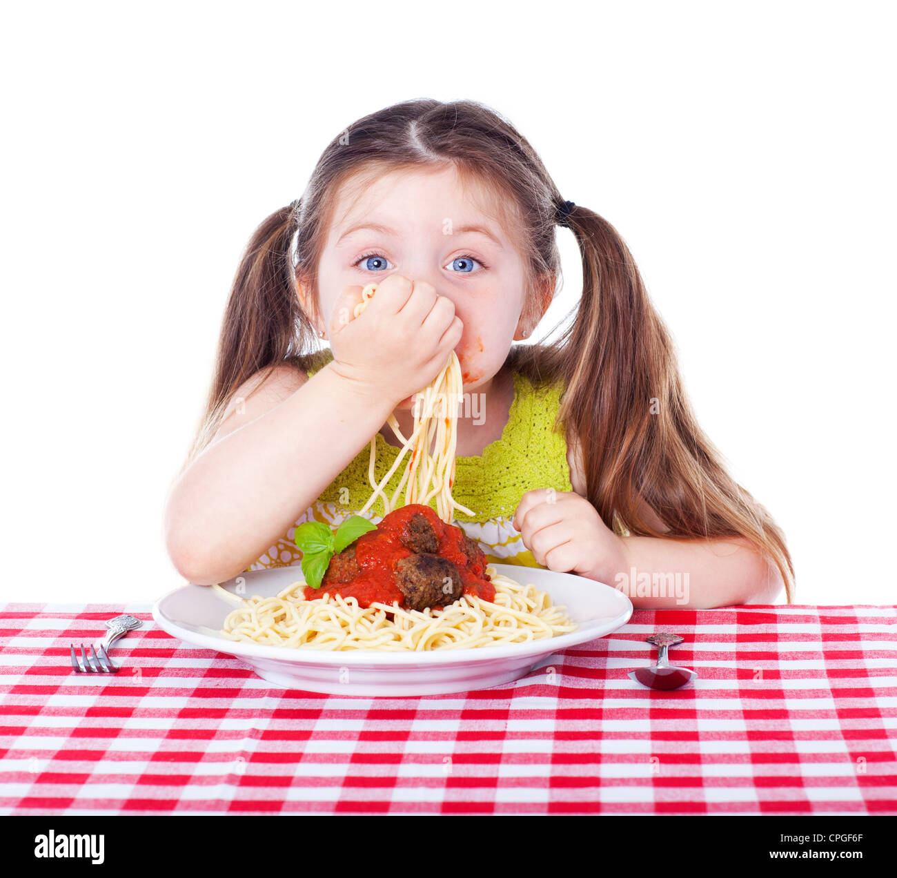Beautiful girl eating pasta and meatballs with hands Stock Photo Alamy