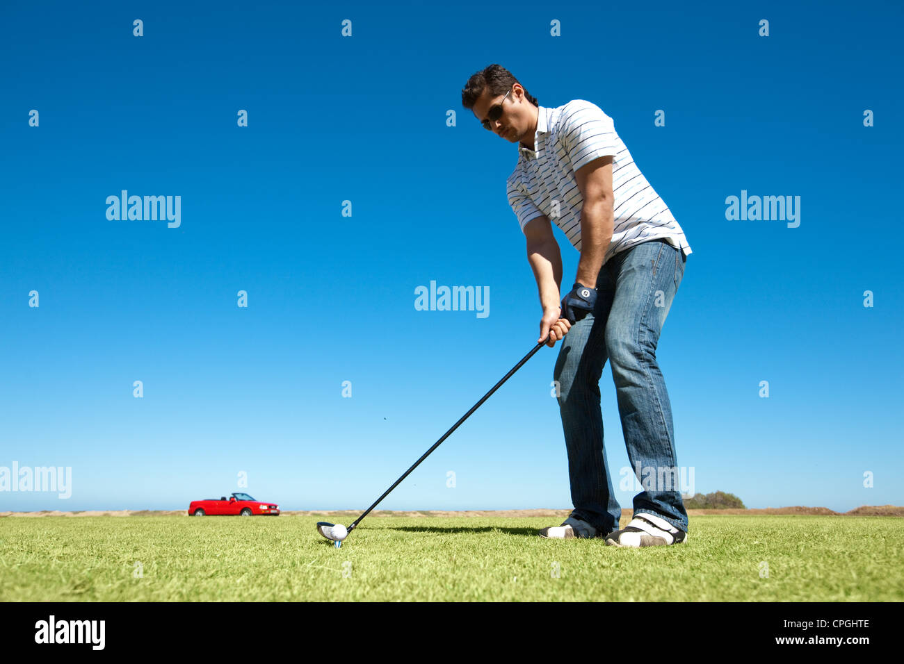 Man Swinging A Golf Club Stock Photo Alamy
