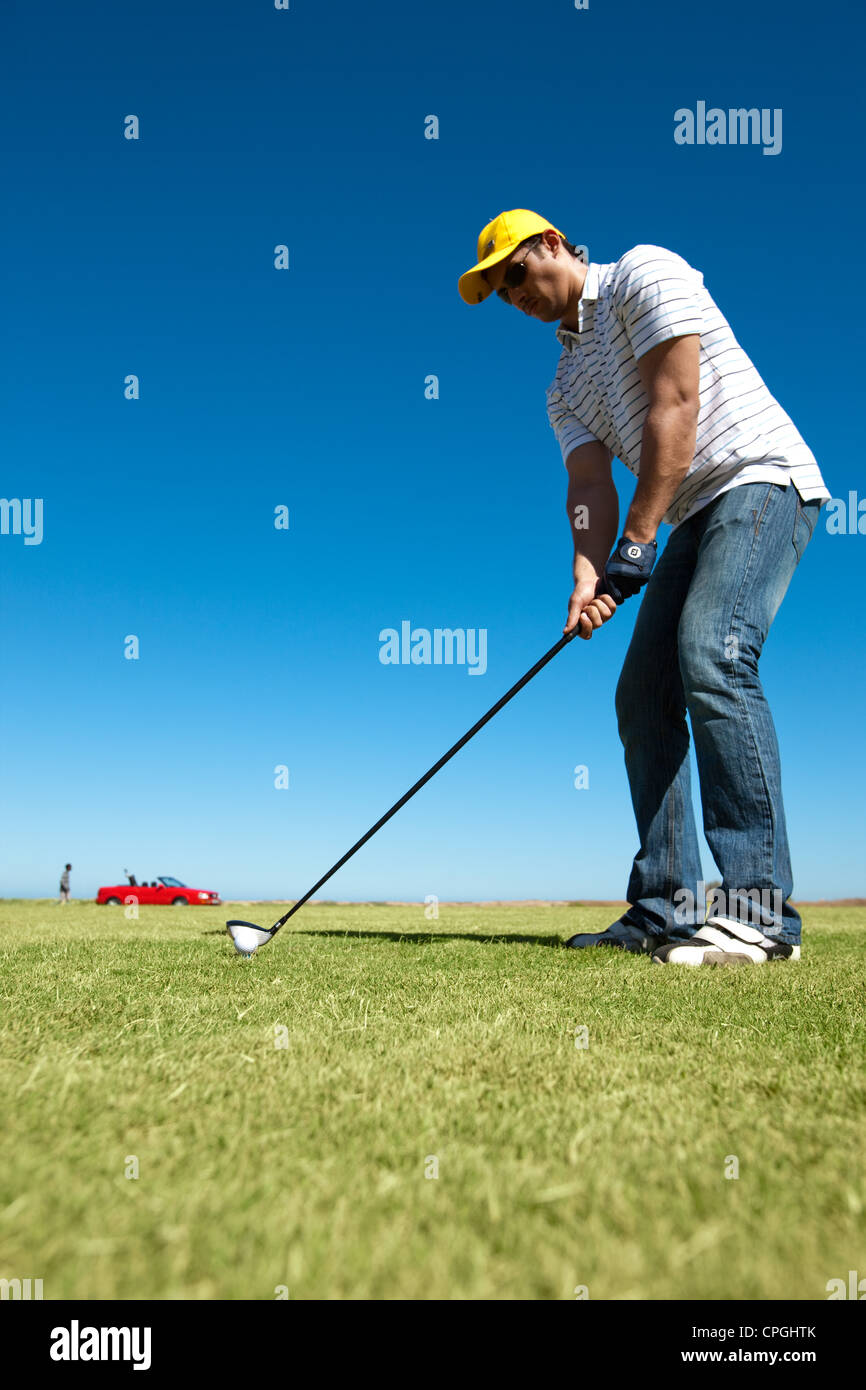 Man swinging a golf club Stock Photo Alamy
