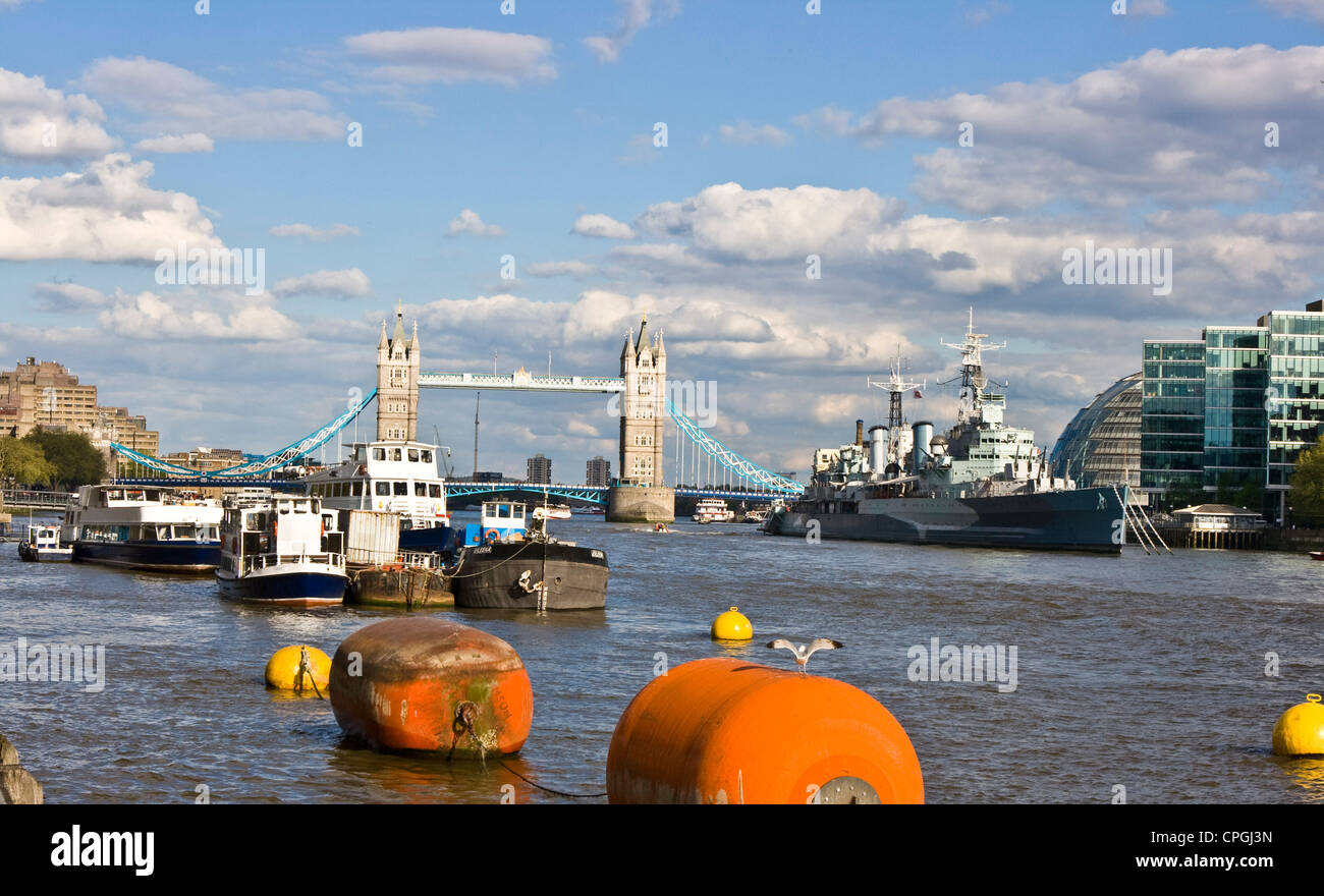 River Thames panorama view scene with grade 1 listed Tower Bridge and museum ship HMS Belfast London England Europe Stock Photo