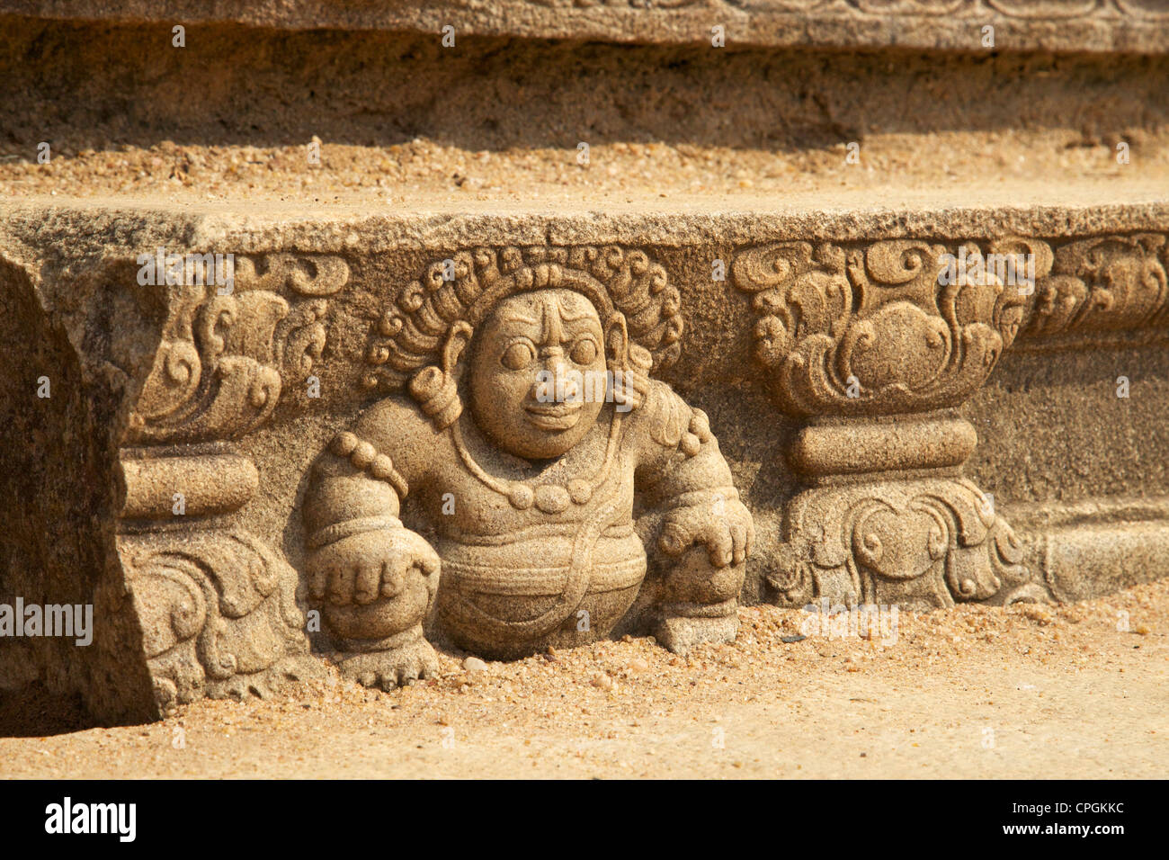 Carved steps to Mahasena Palace showing a protective gana, or dwarf, an attendant of Kutera, the god of wealth Anuradhapura Stock Photo