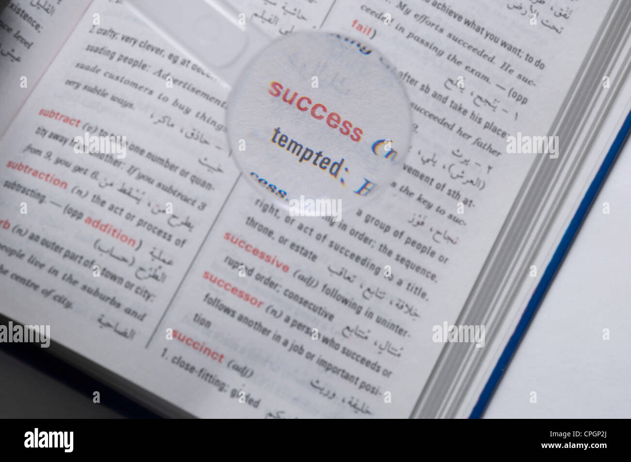 Magnifier on dictionary, closeup, elevated view Stock Photo Alamy