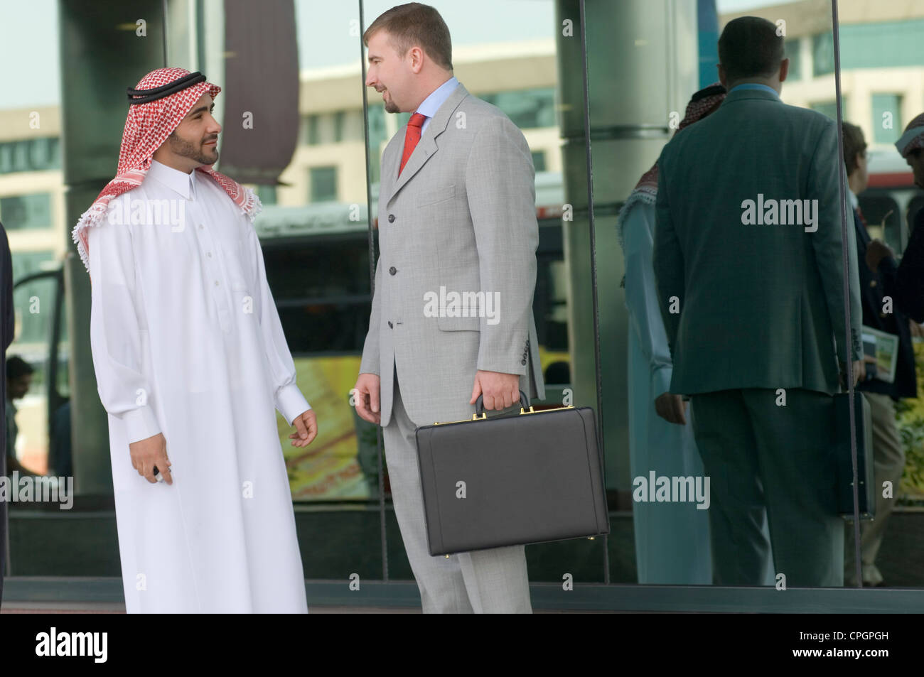 Two businessmen walking side by side hi-res stock photography and ...