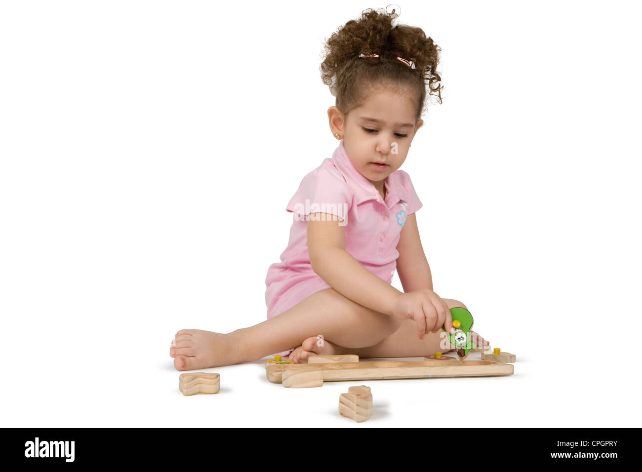 Girl playing with puzzle Stock Photo Alamy