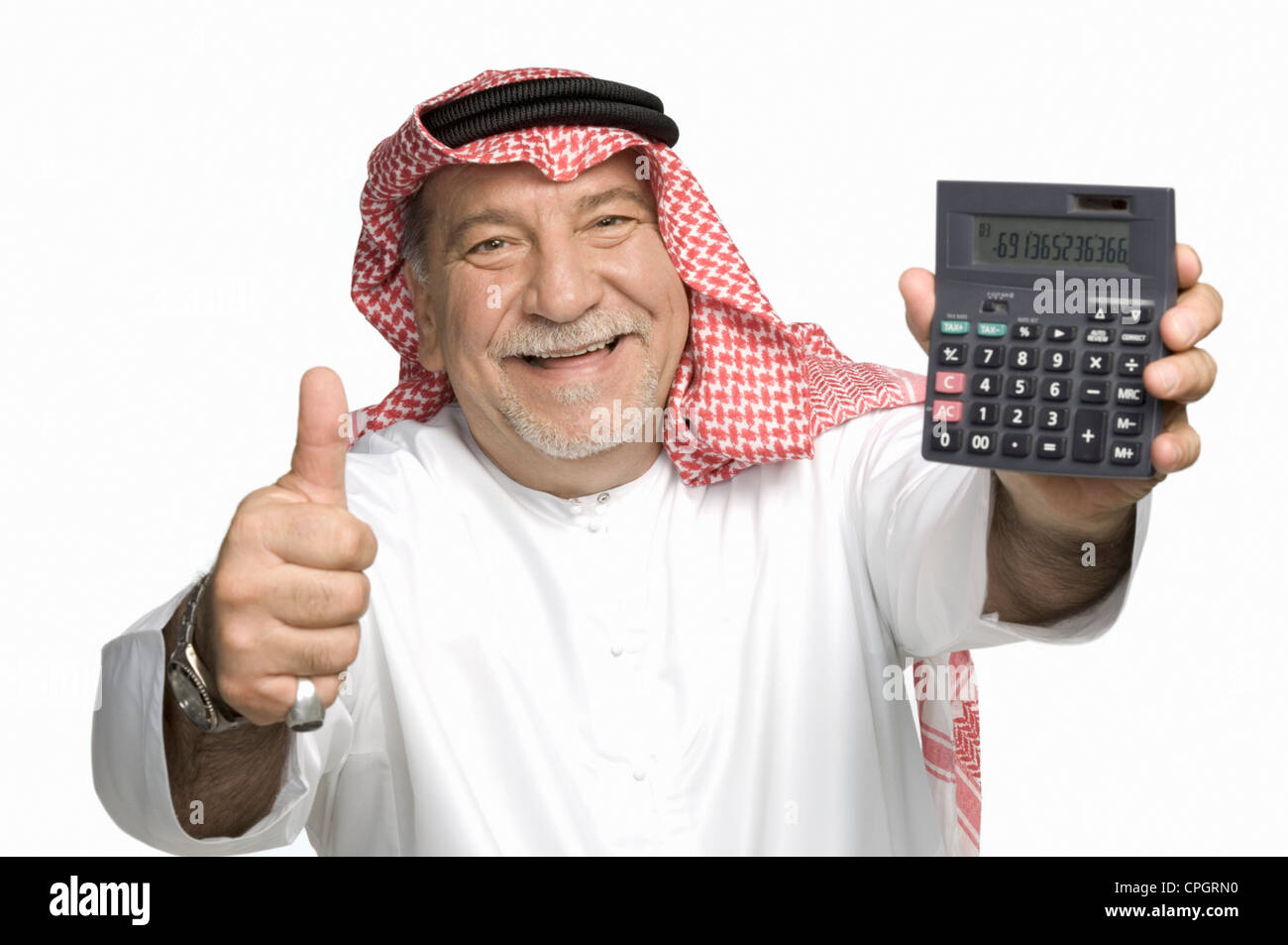 Mature man holding calculator, showing thumbs up, portrait Stock Photo