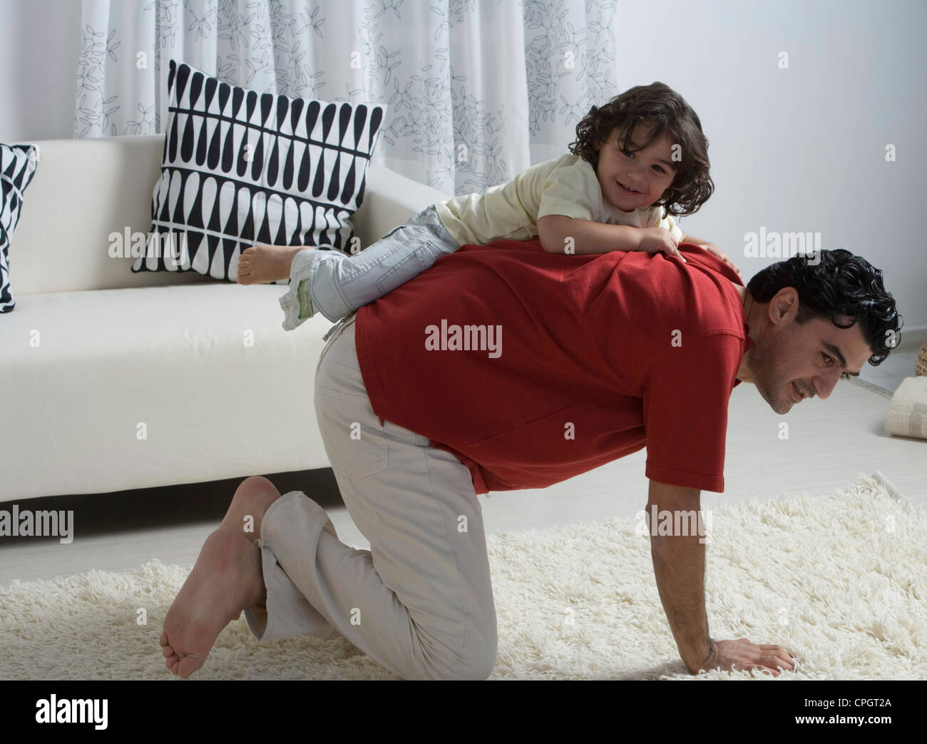 Father playing with sons back view hi-res stock photography and images ...