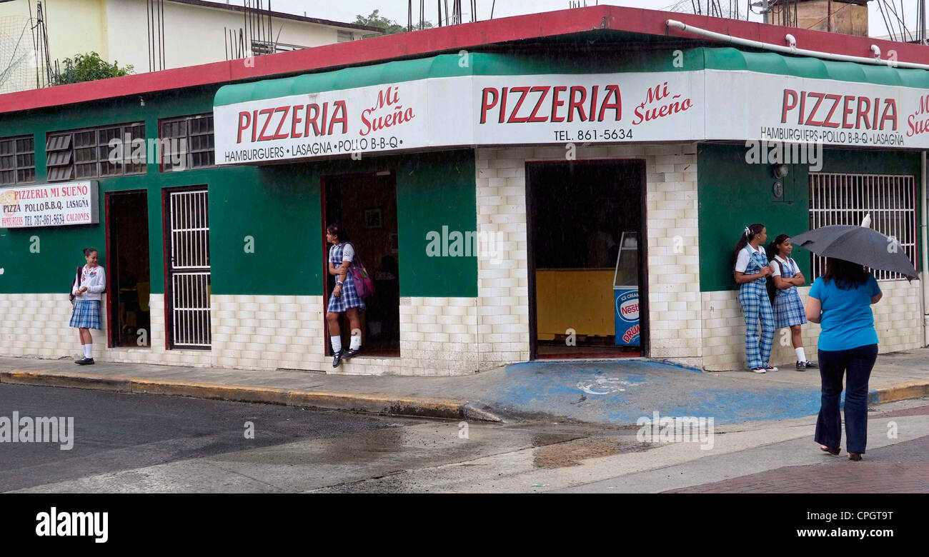 PUERTO RICO Caribbean island   YABUCOA schoolchildren hang out at a Pizzeria fast food restaurant in the town. Stock Photo