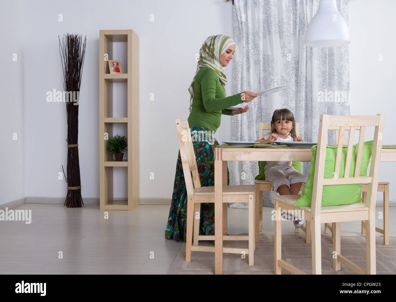 Child setting table plates hi-res stock photography and images - Alamy