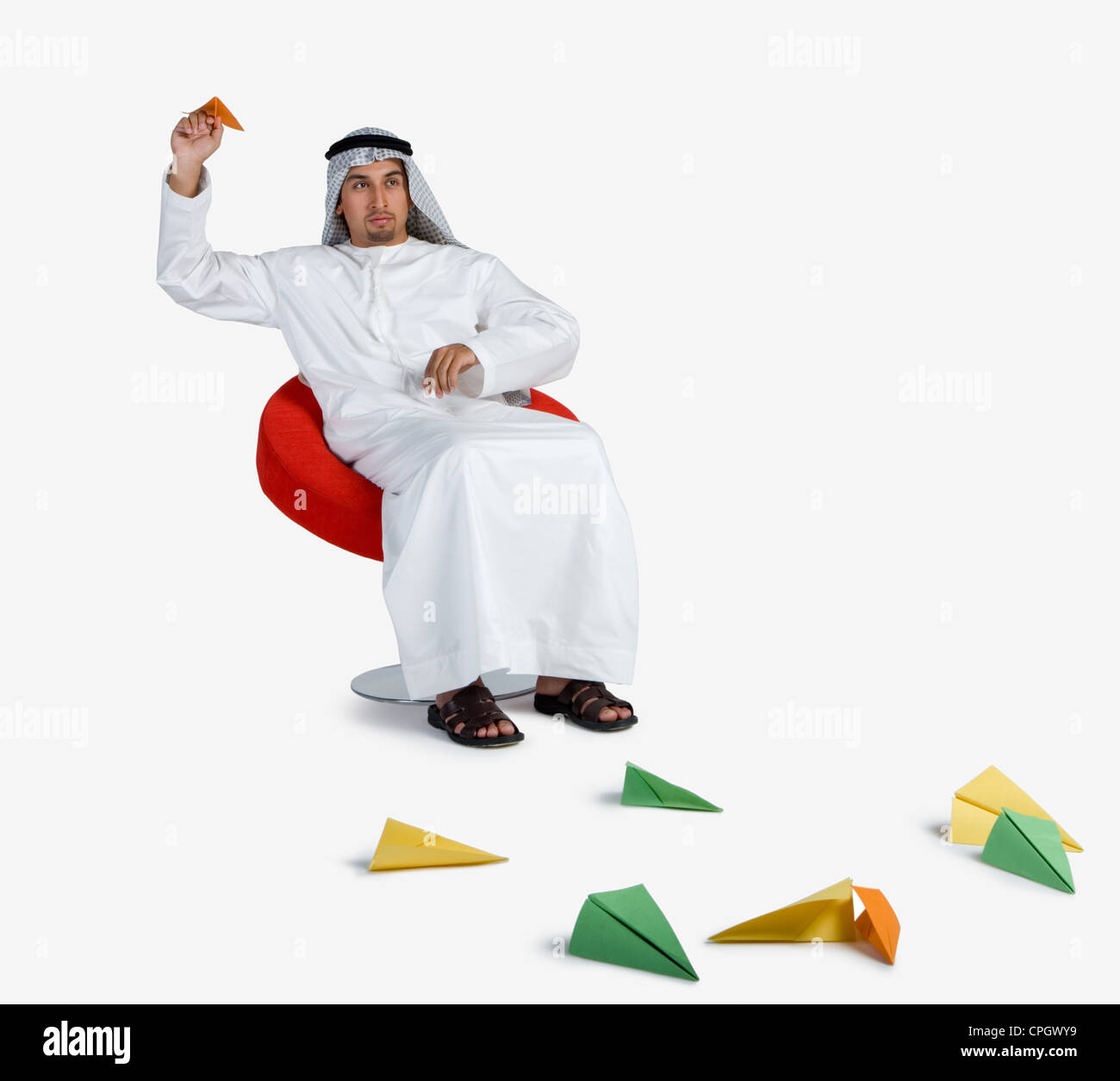 Young man playing with paper planes Stock Photo