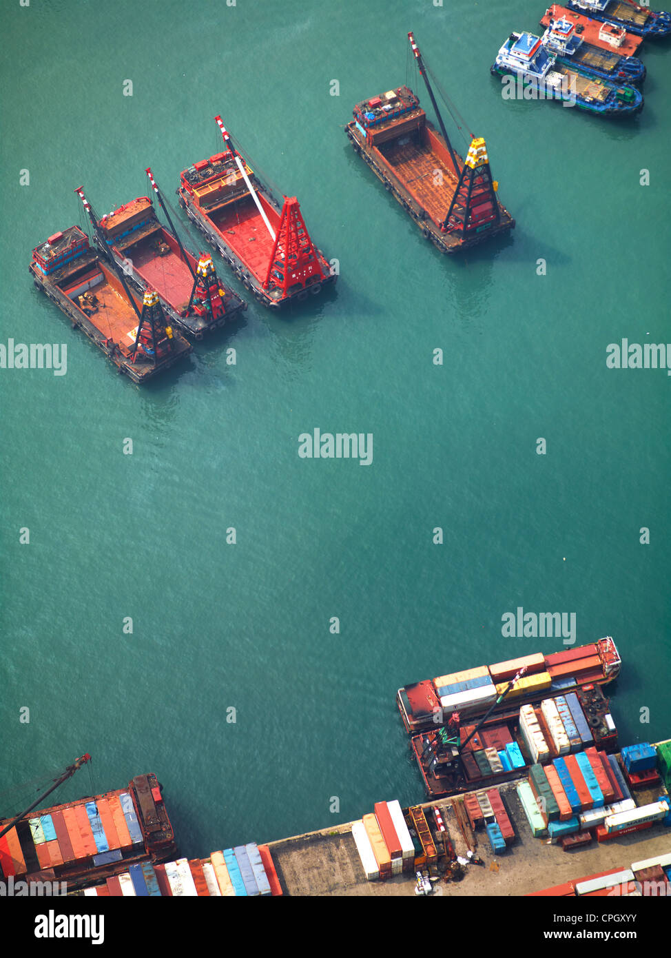 Aerial view of Hong Kong ships, containers and cargo vessels in Victoria Harbour. September 2011. Stock Photo