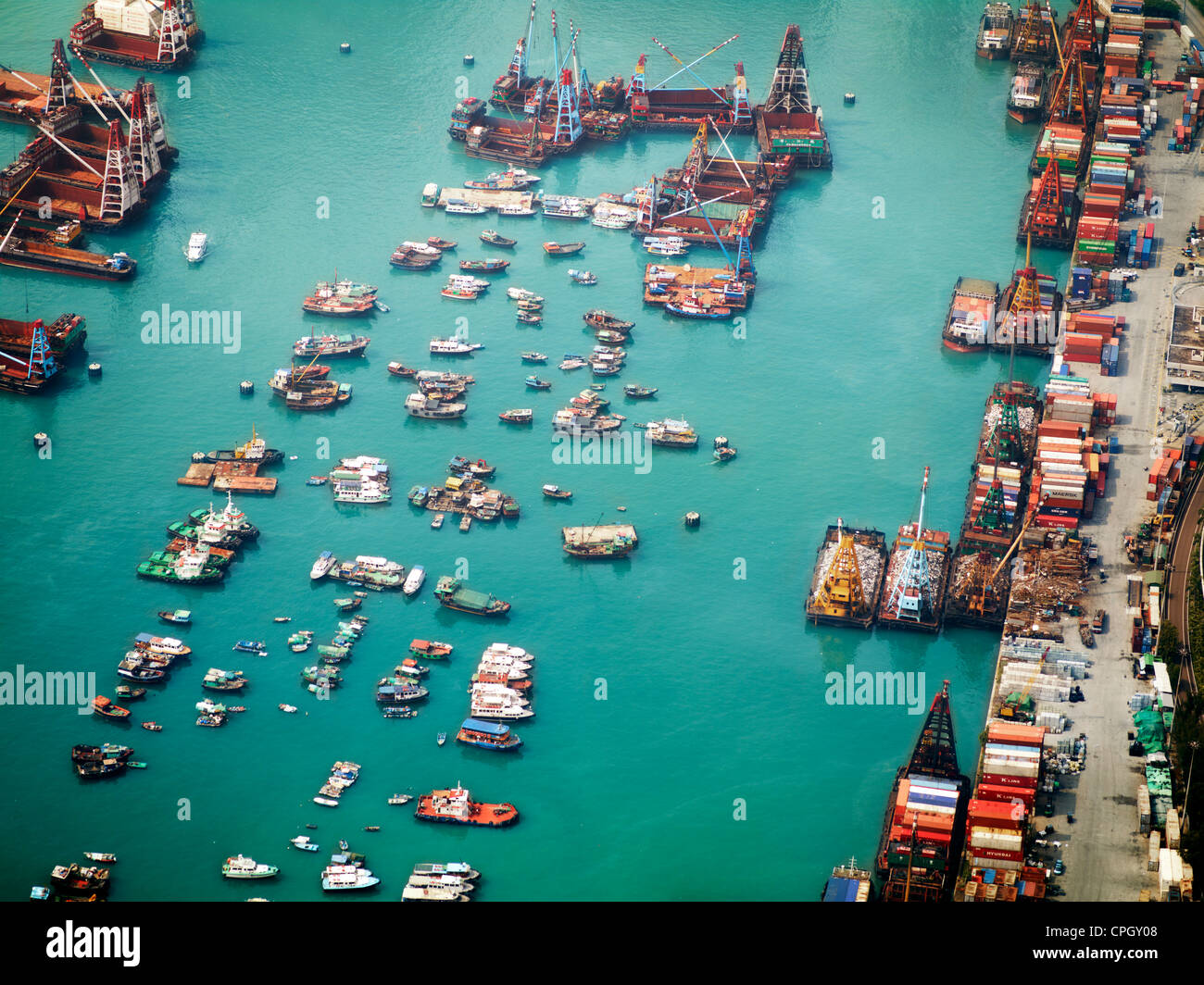 Aerial view of Hong Kong ships, containers and cargo vessels in Victoria Harbour. September 2011. Stock Photo