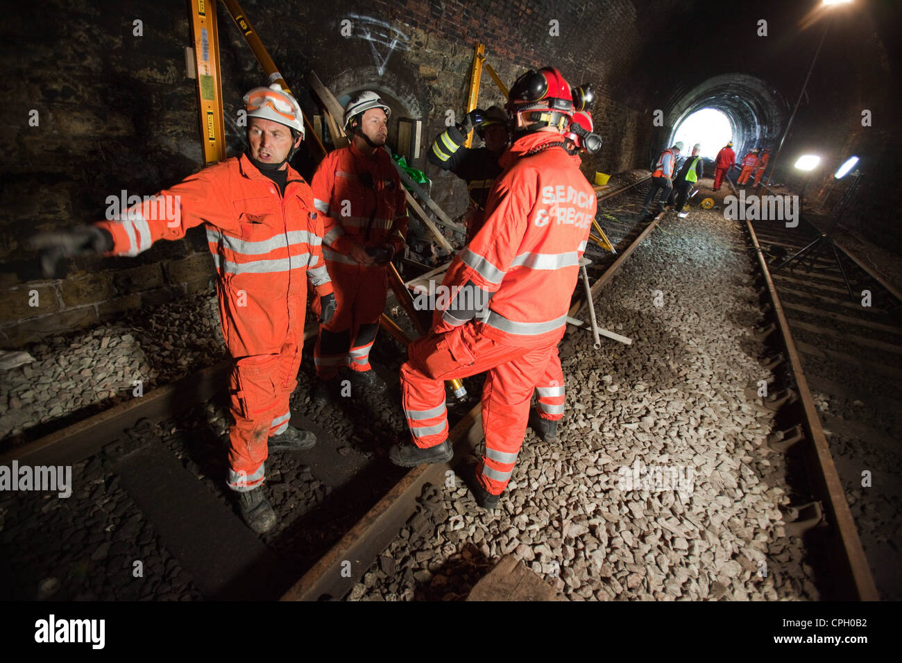 Mountain rescue, fire and railway workers practice emergency drills in a disused railway tunnel in Oldham Lancashire UK Stock Photo
