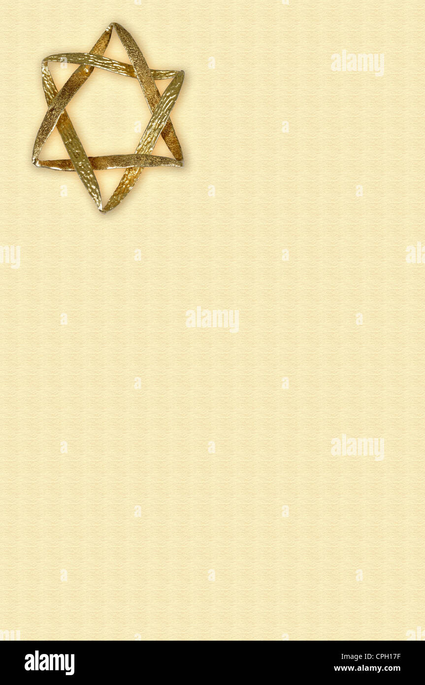 Gold Star of David with an outer glow on a cream coloured background. Stock Photo