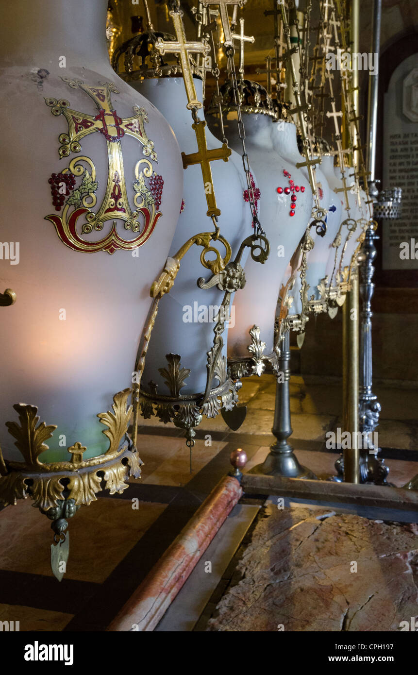 Close up of traditional lamps hanging above the Stone of Anointing