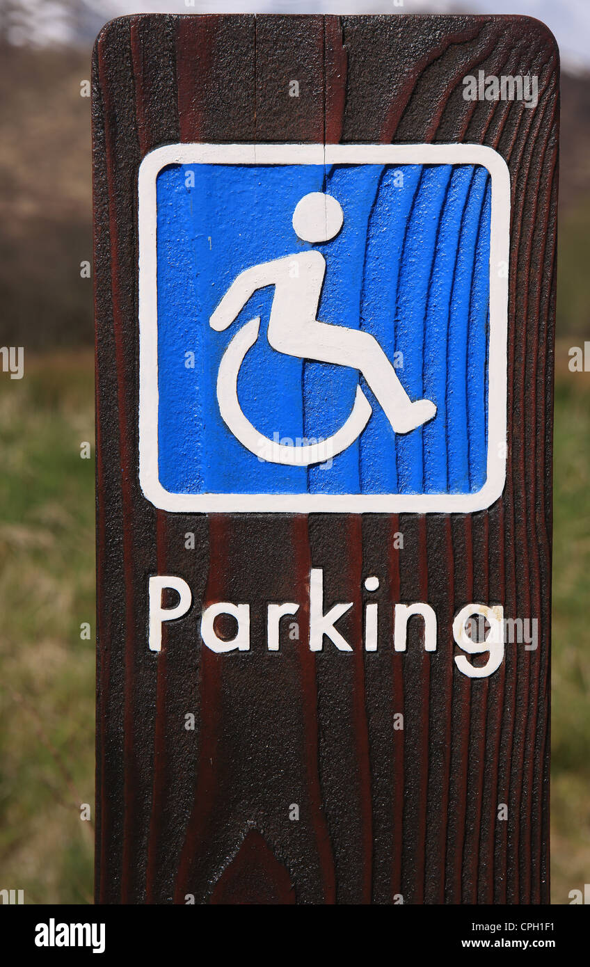 Disabled parking sign on wood Stock Photo