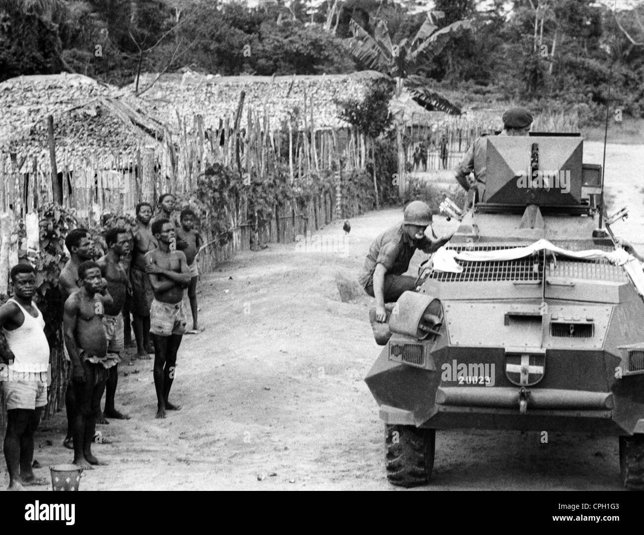 geography/travel, Congo, events, Simba uprising 1964 - 1965, mercenaries with armoured vehicle in a village on the street from Lisala to Bumba, Equateur province, 6.10.1964, Democratic Republic of the Congo, Congo Crisis, Civil War, military, arms, Africa, 20th century, historic, historical, arms, tank, 1960s, people, Additional-Rights-Clearences-Not Available Stock Photo