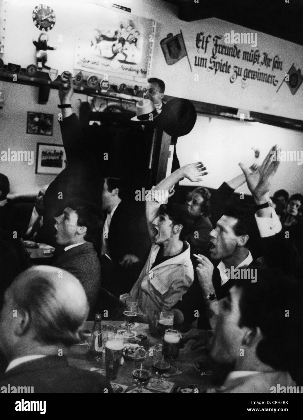 sports, football / soccer, 1966 FIFA World Cup, final West Germany against England, German fans burst out in cheers in a restaurant in Frankfurt/Main as their team scores a goal, 30.7.1966, Additional-Rights-Clearences-Not Available Stock Photo