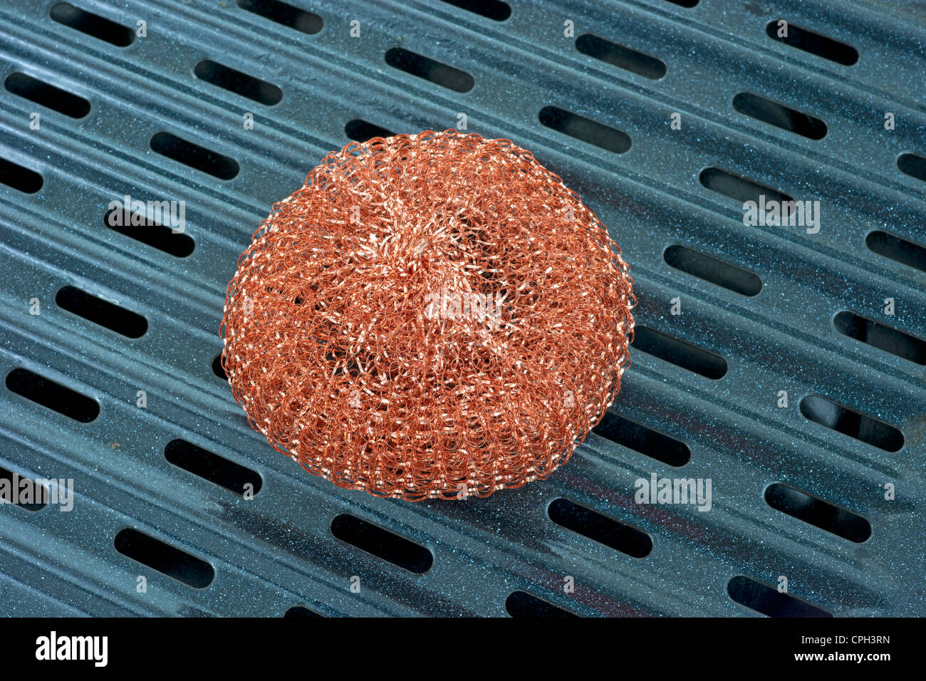 Copper scouring pad on broiler pan Stock Photo Alamy