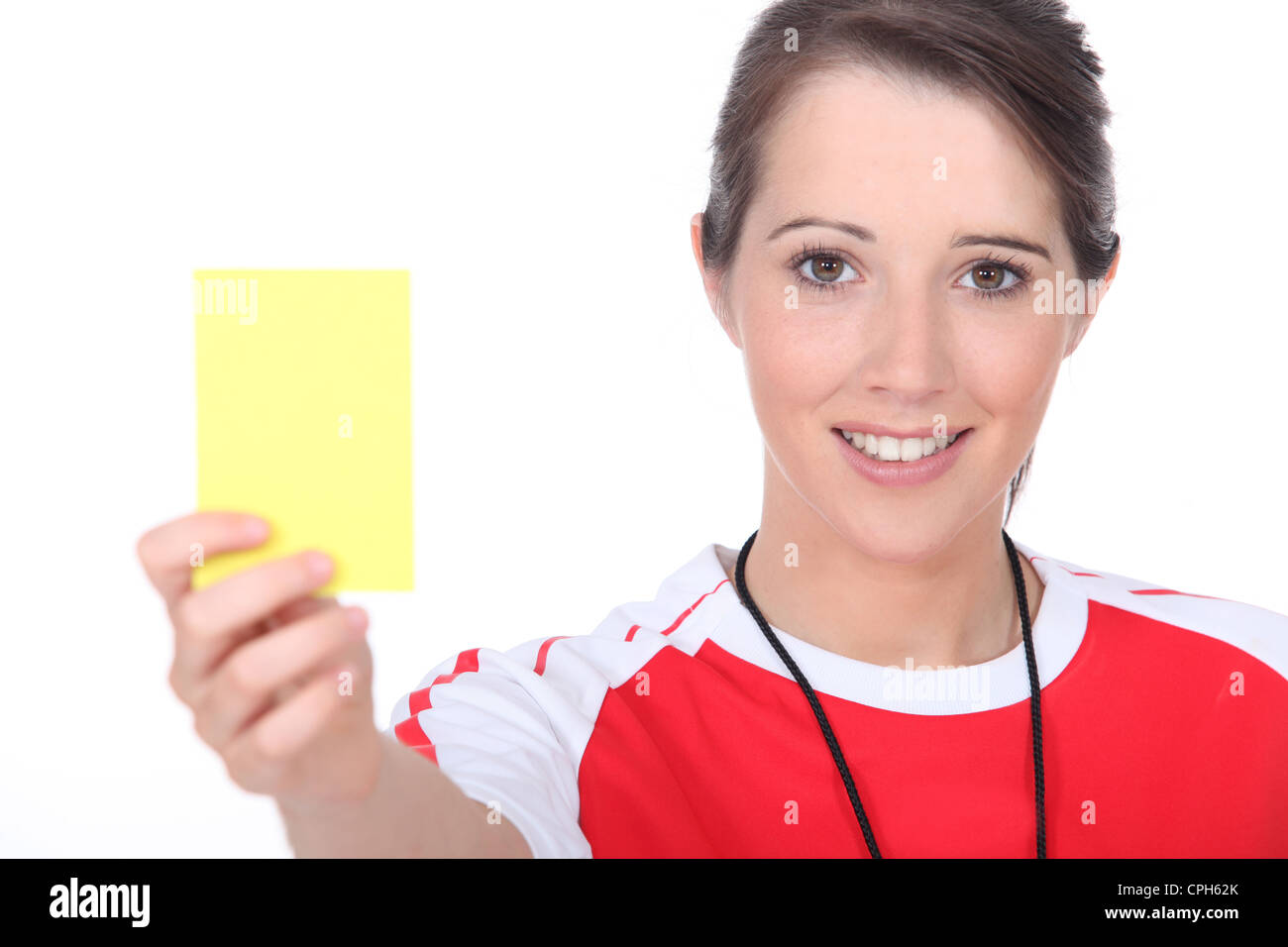 Referee holding up a yellow card Stock Photo Alamy