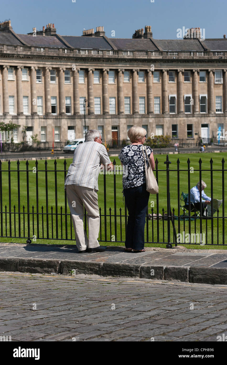 Elderly couple stand viewing the houses in Bath's famous Royal
