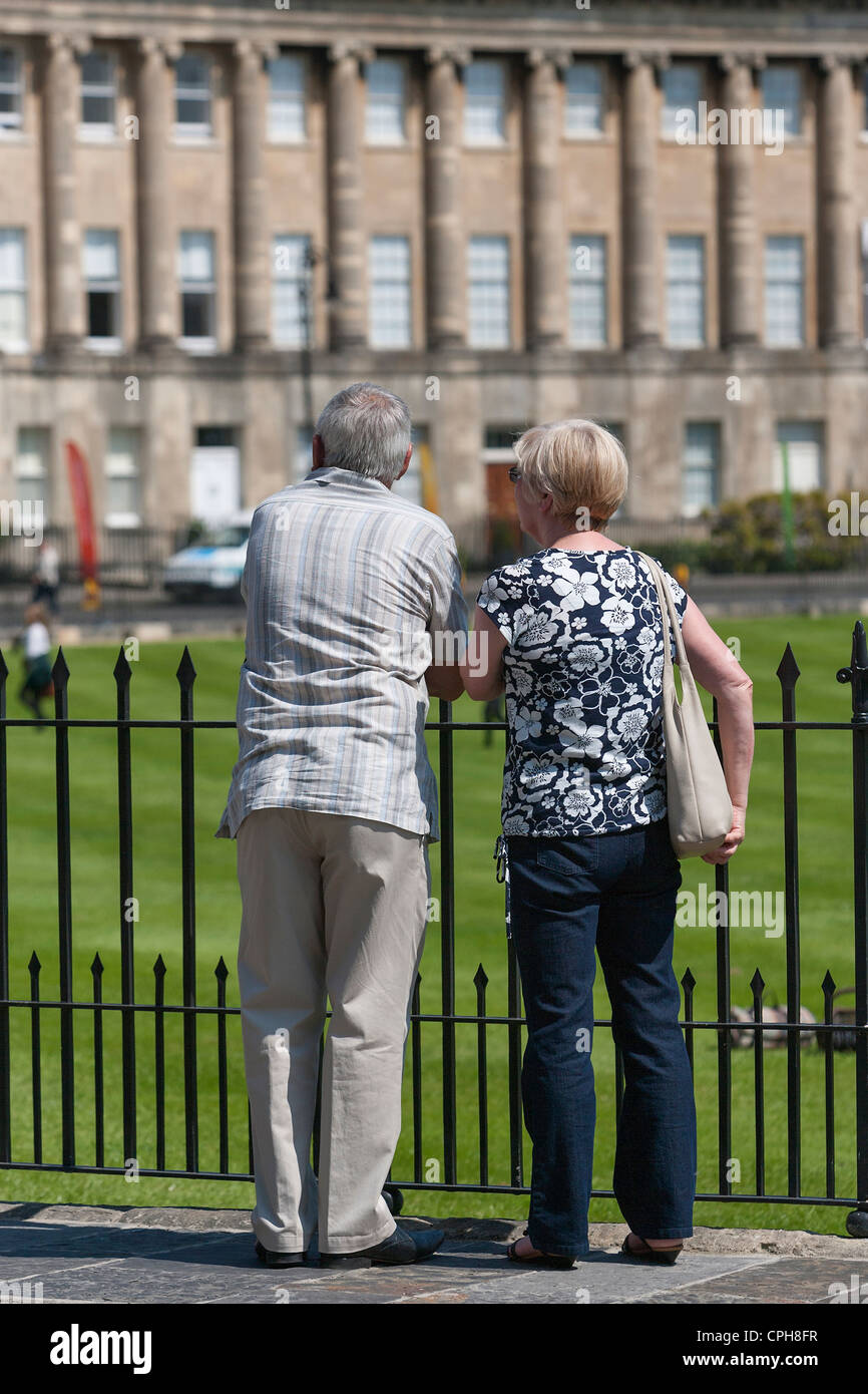 Elderly couple stand viewing the houses in Bath's famous Royal