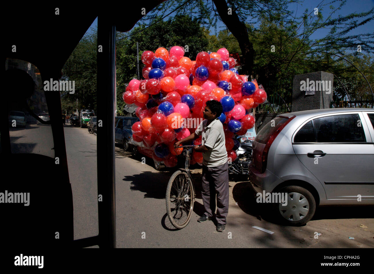 Street seller selling childrens helium balloons Stock Photo - Alamy