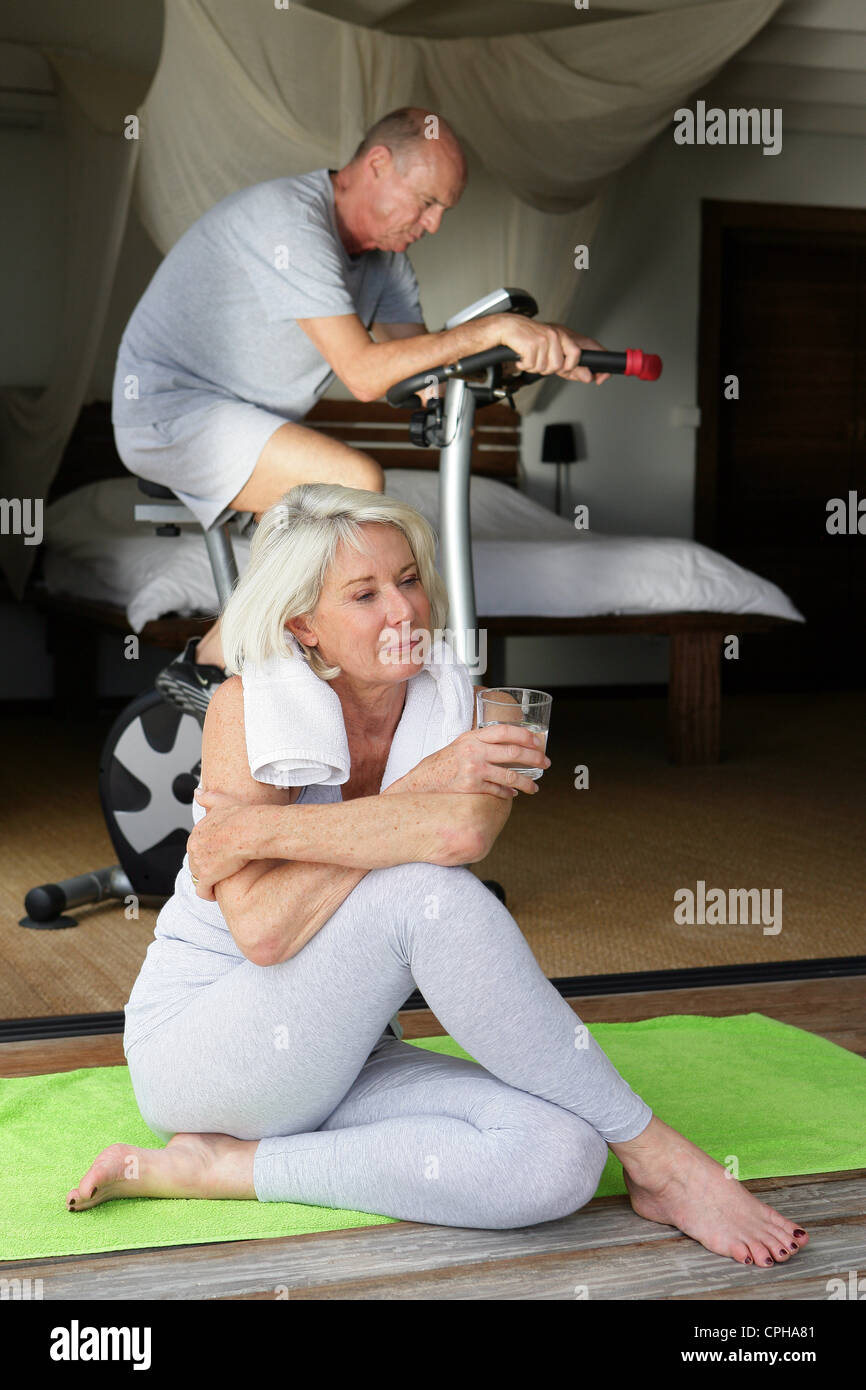 Senior couple doing gymnastics in the room Stock Photo - Alamy