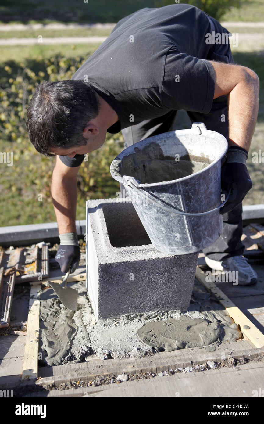 Mason working on building foundations Stock Photo Alamy