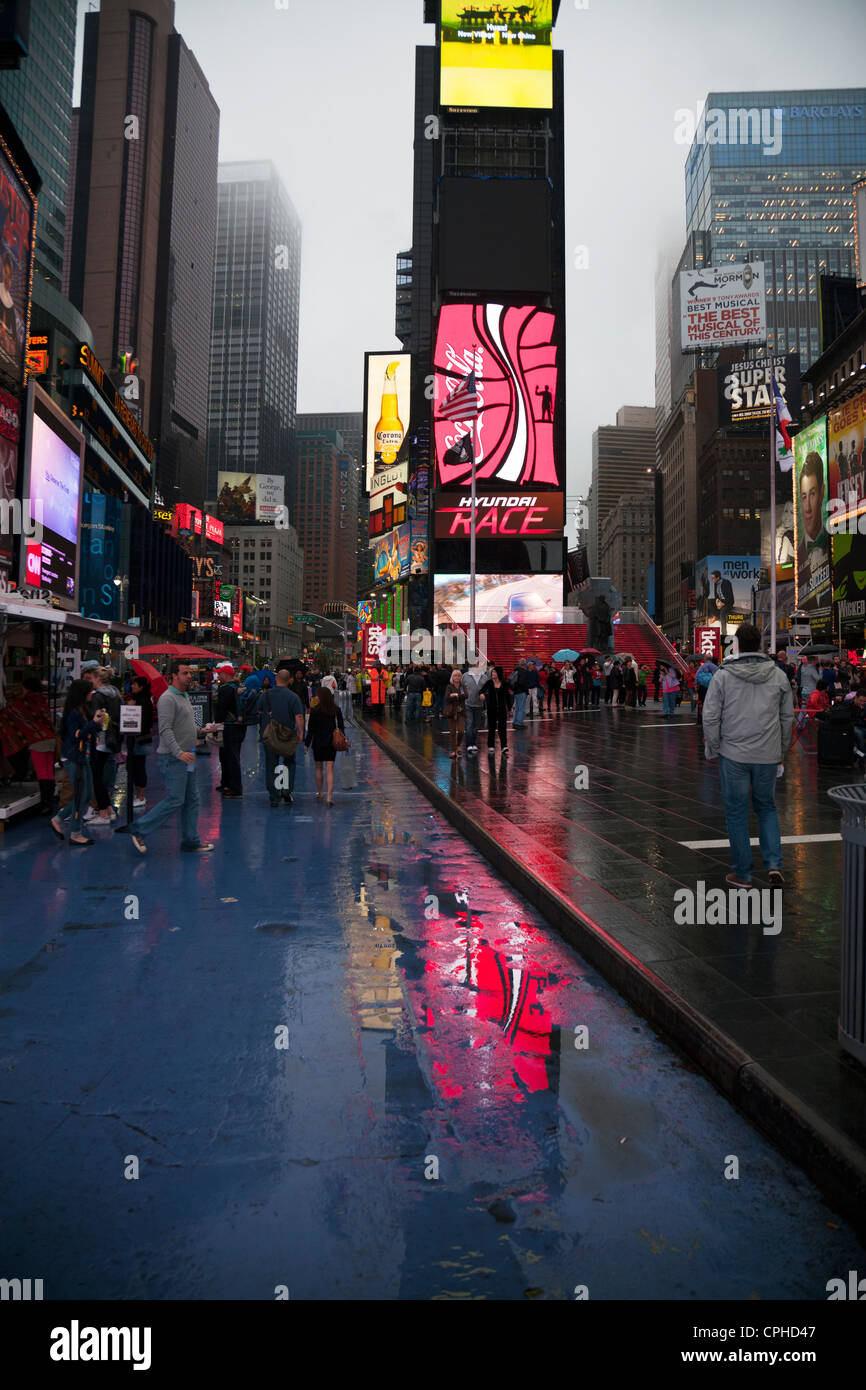 Times square reflection dusk wet rain new york hi-res stock