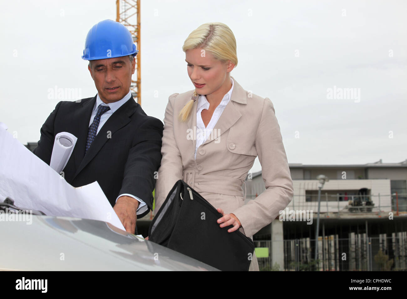 Architect and assistant visiting construction site Stock Photo Alamy