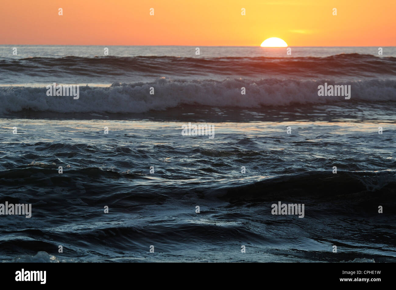 Sunset, surf, Pacific ocean, sea, waves, crashing, Estuary, protected, nature reserve, Area Protegia Estero, Isla del Venado, Ni Stock Photo