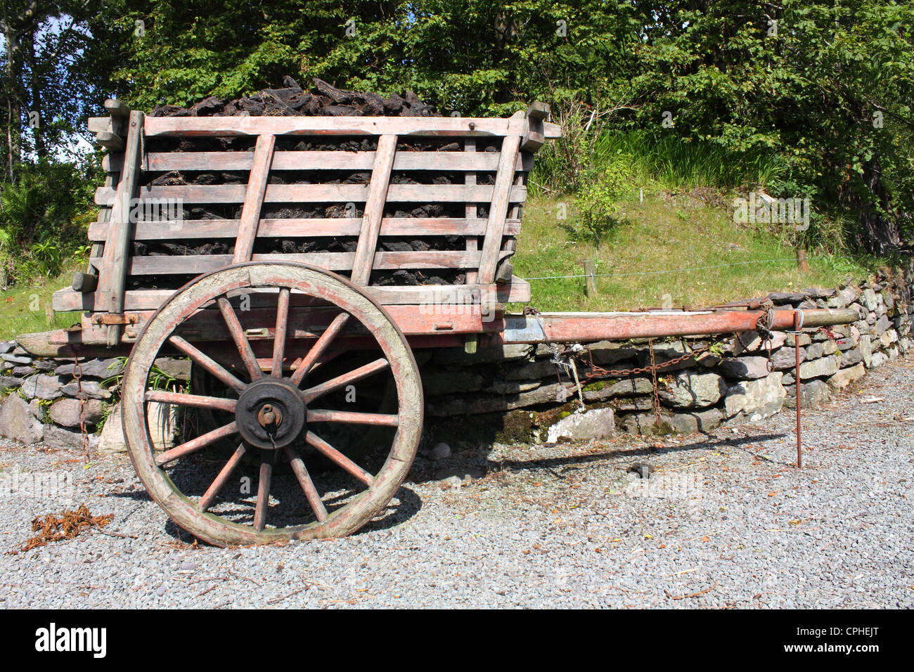 old cart in Ireland stacked high with peat Stock Photo Alamy
