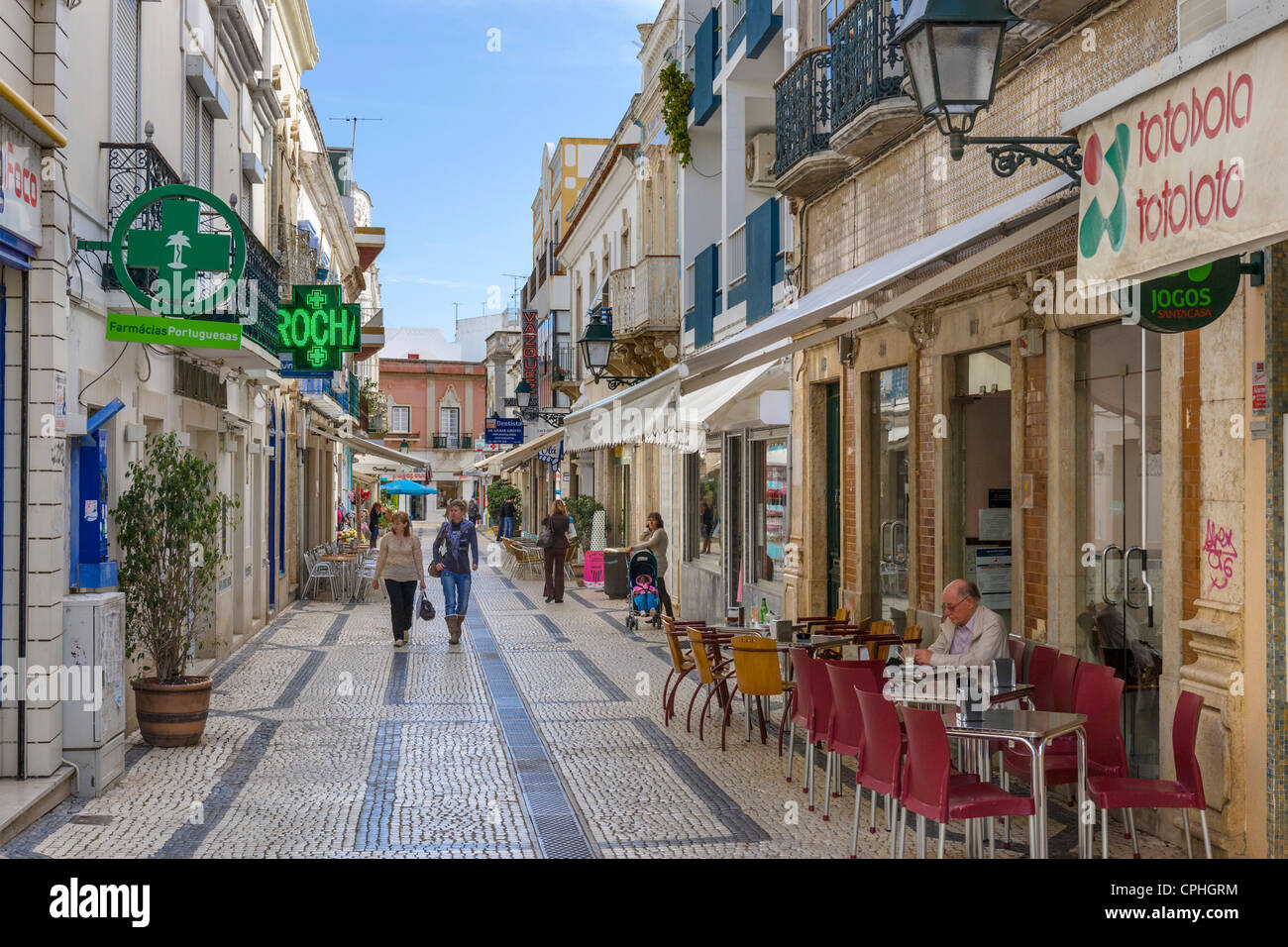 Shops and cafe on Rua do Comercio in the old town centre, Olhao, Algarve, Portugal Stock Photo