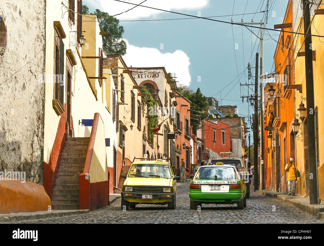 Street scene from San Miguel de Allende. Shows typical colorful architecture and narrow cobblestone streets. Stock Photo