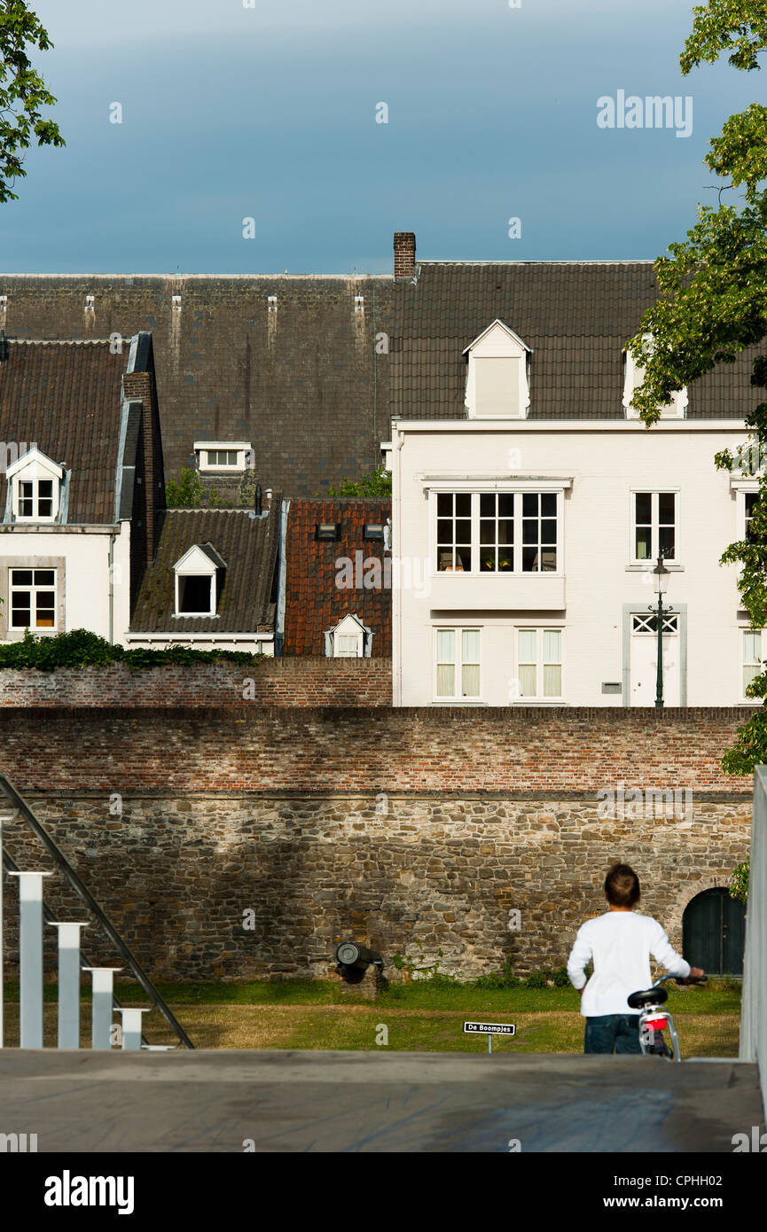 Woman with bycicle crossing the 'Hoger Brug' (Higher Bridge) on the River Maas, Maastricht, Limburg, The Netherlands, Europe. Stock Photo