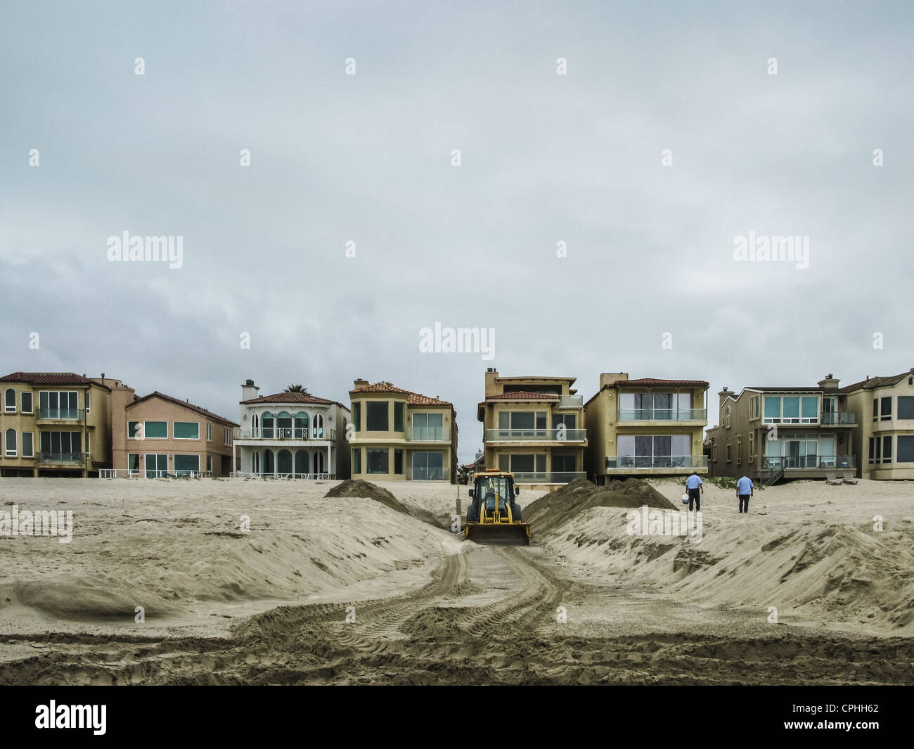 A Trench dug at the beach in Oxnard California with beach front homes