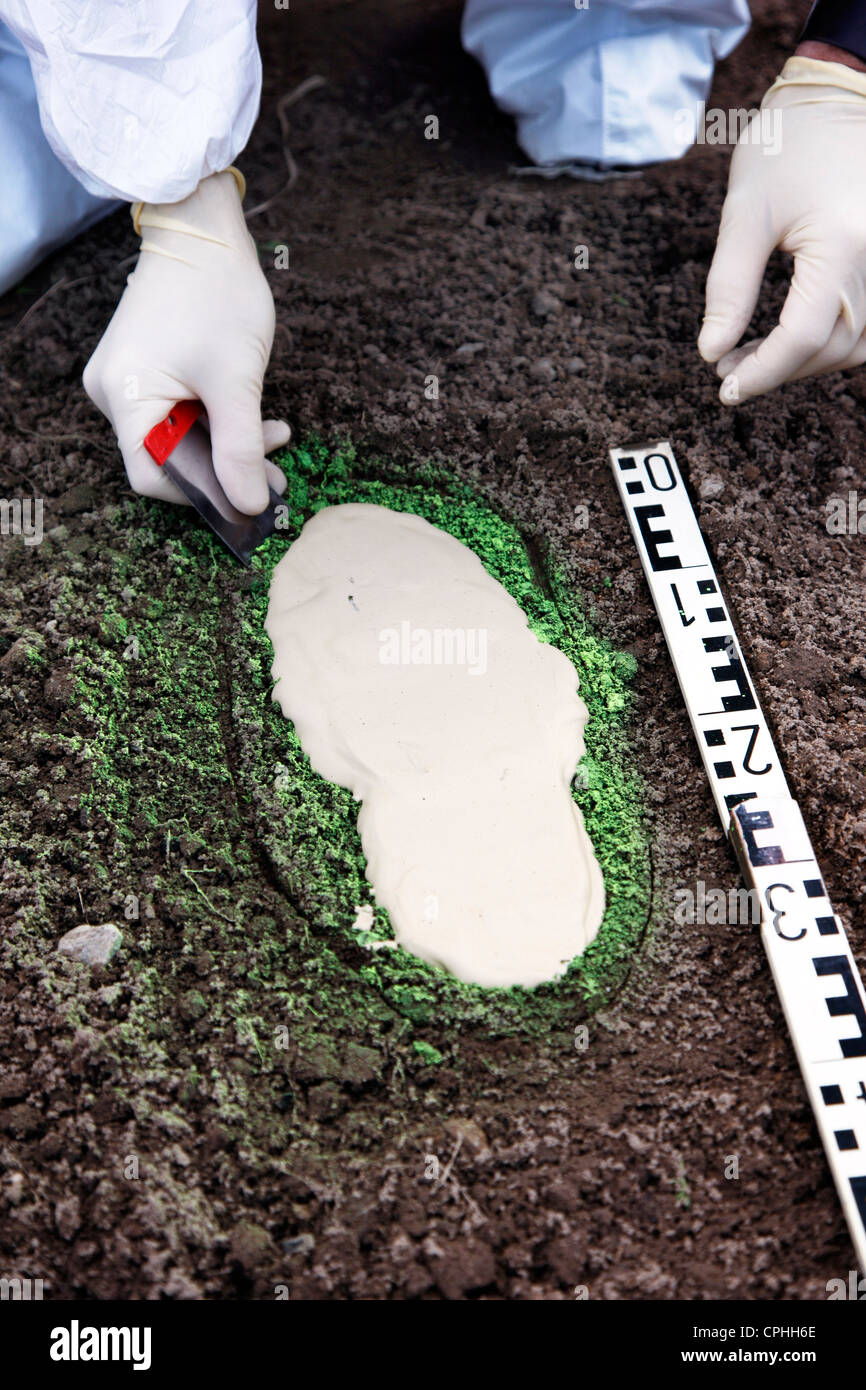 Police, crime scene investigation. Police saves footprints at a crime scene. Stock Photo
