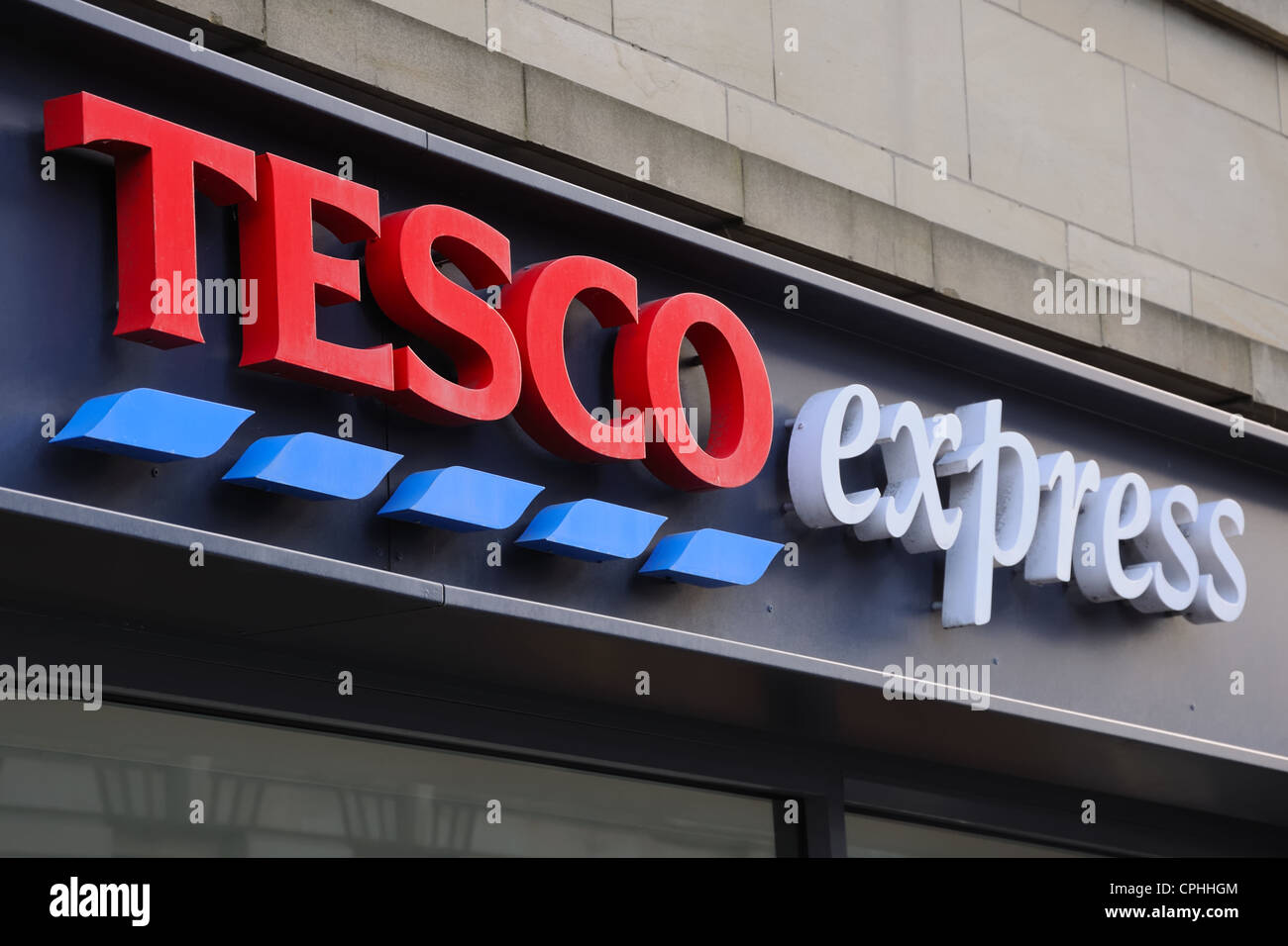 Tesco express sign above shop in Glasgow. Stock Photo