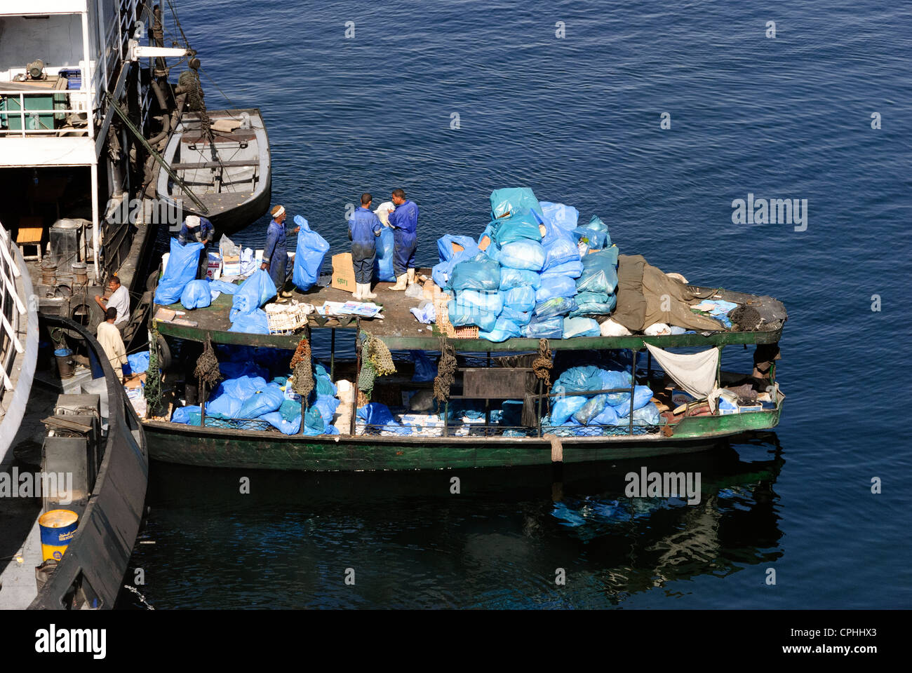 Waste disposal boat Aswan, Upper Egypt Stock Photo Alamy