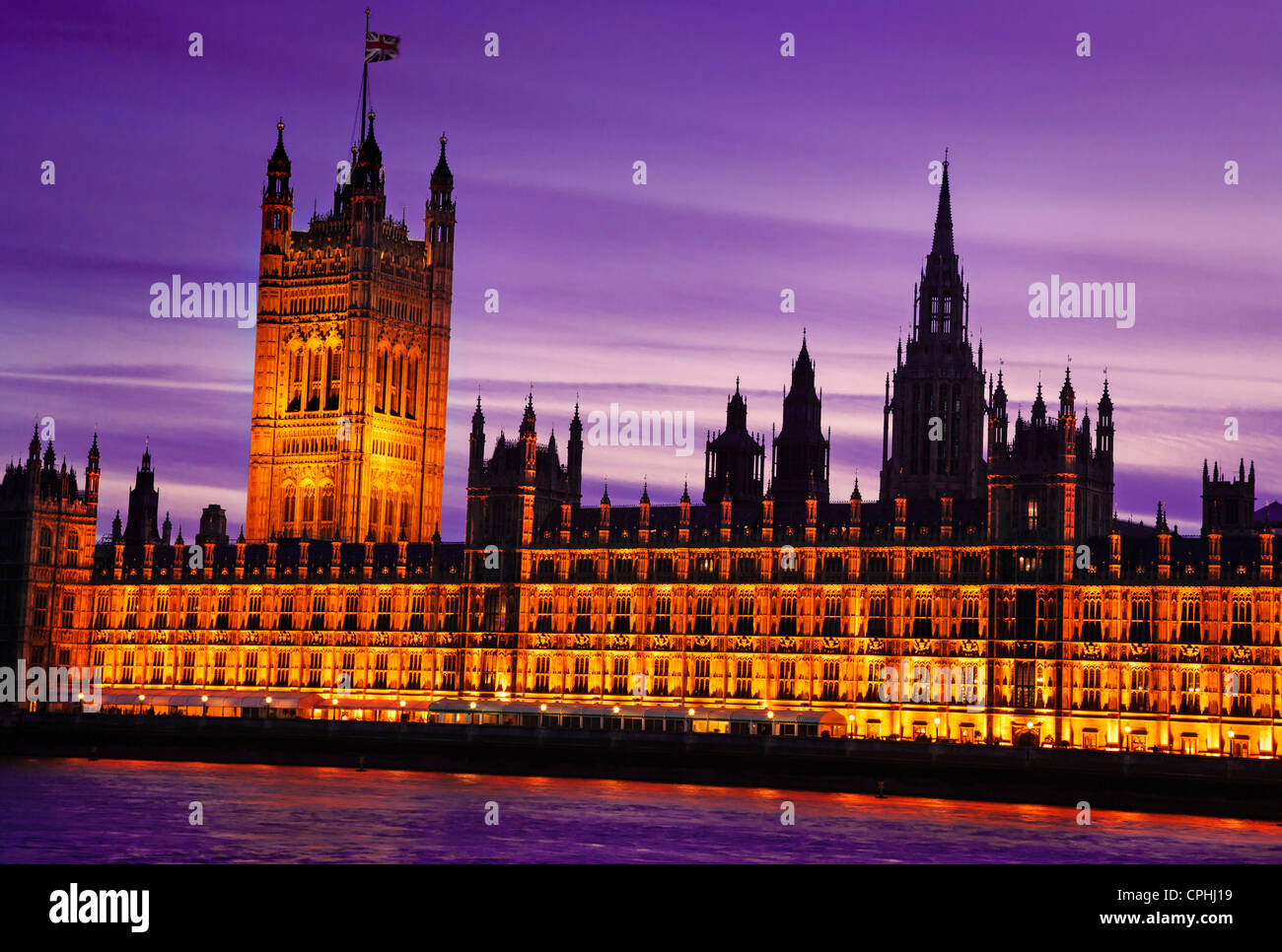 Westminster Palace, Houses of Parliament illuminated at dusk, London, England Stock Photo