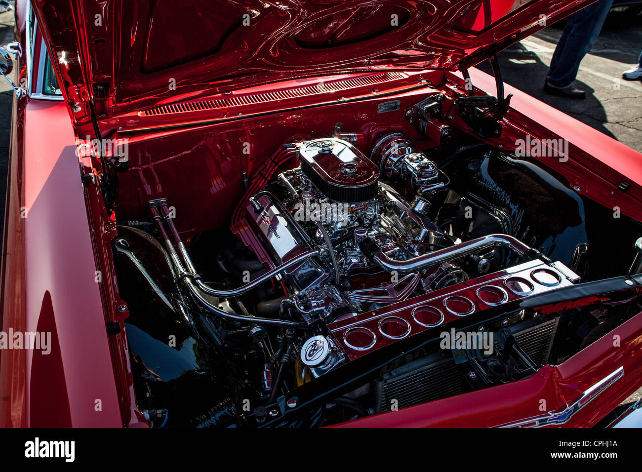 A nicely detailed engine compartment in a Chevrolet hot rod Stock Photo