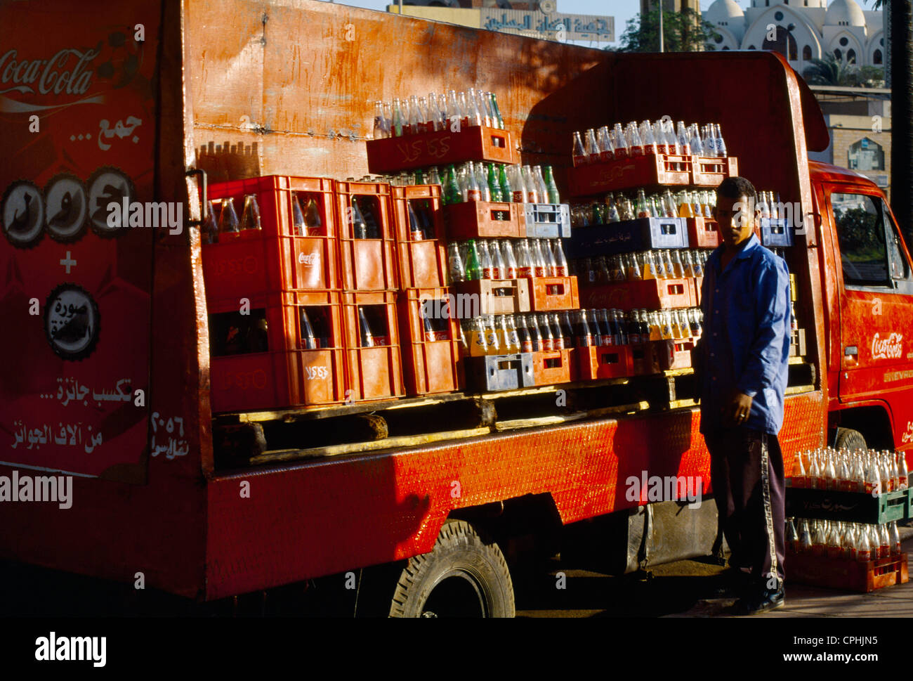Aswan Egypt Coca Cola Delivery Van Man Delivering Drinks And Collecting Empty Bottles Stock Photo