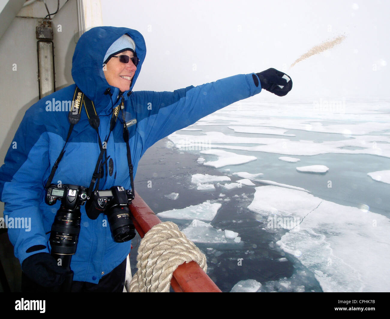 Donna scattering mom's ashes M/V Antarctic Dream Spitsbergen Norway Stock Photo