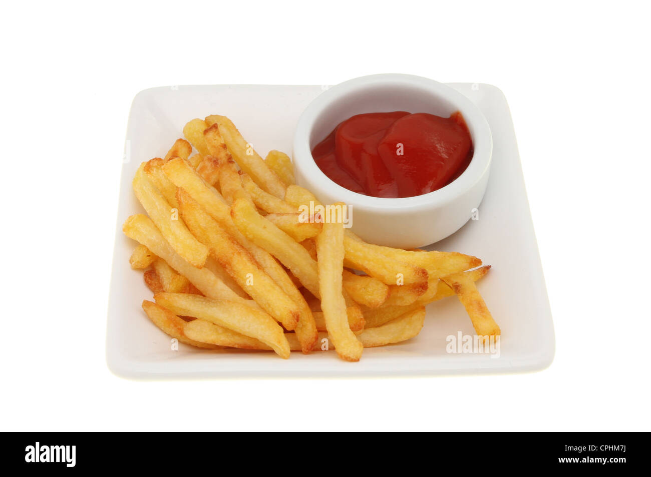 French fries in a bowl with a ramekin of tomato ketchup isolated against white Stock Photo