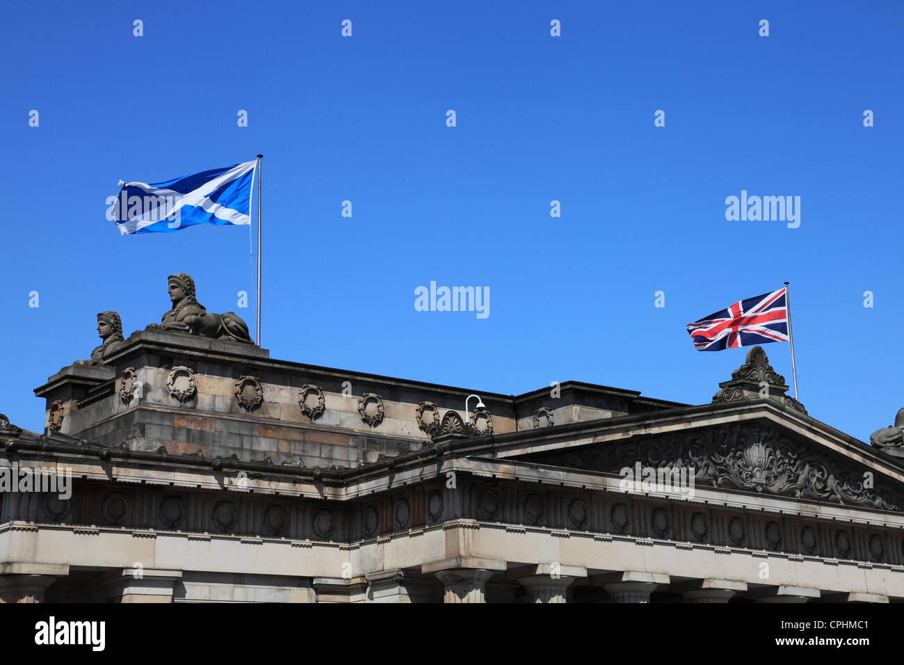 Scottish and British flags fly above the Scottish National Gallery within Edinburgh Scotland UK Stock Photo