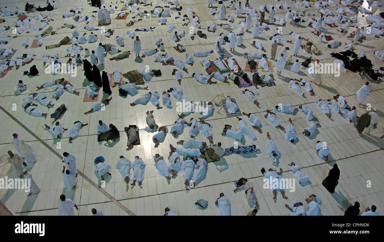 Muslim pilgrims resting in Al Haram mosque Mecca Saudi Arabia Stock Photo