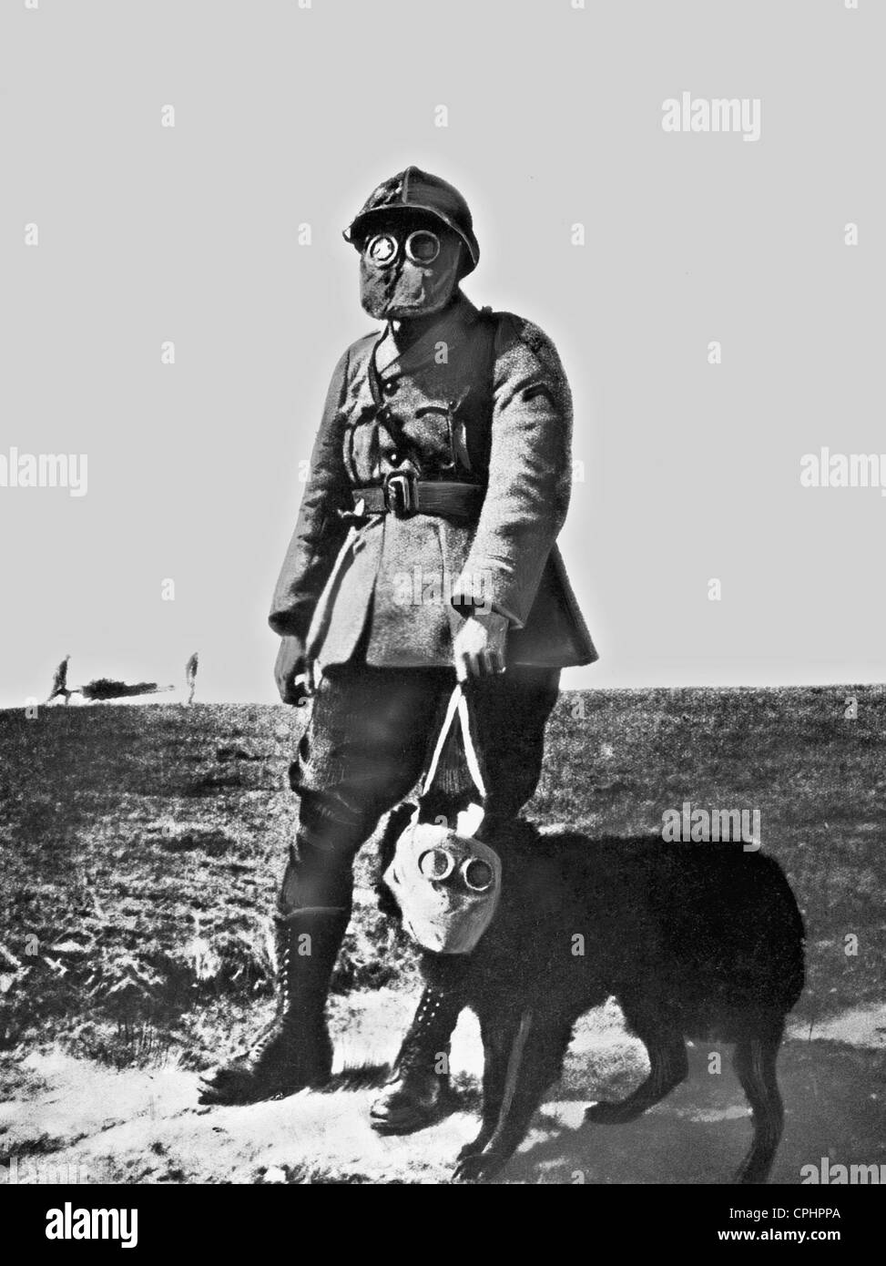 French soldier and dog with gas masks, 1917 Stock Photo