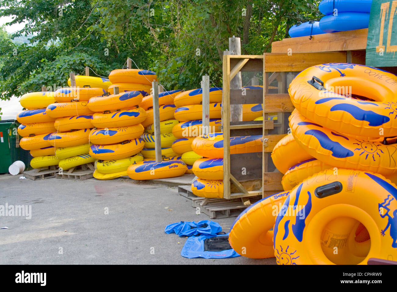 Large yellow inner tubes rented to people for floating down the Root River. Lanesboro Minnesota